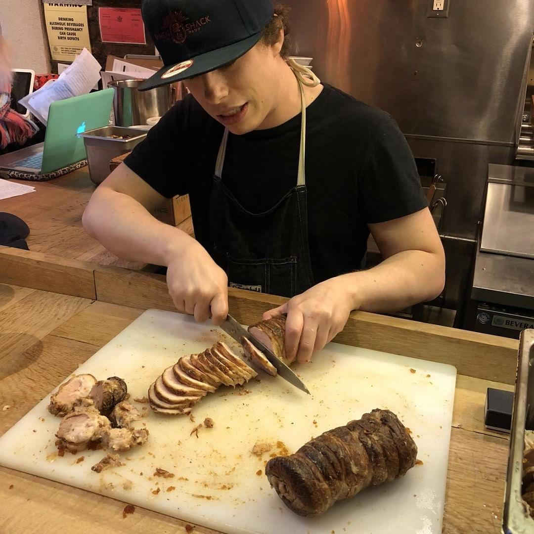 Mike slicing chashu with his new knife. those slices were thicc! photo by kano vuong